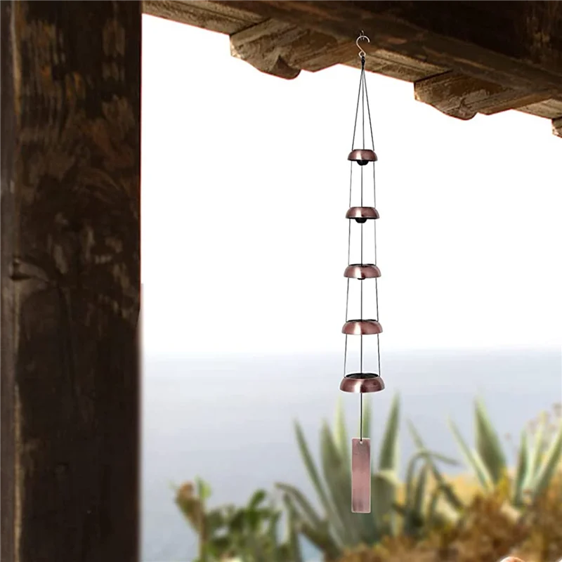 Decorative hanging rain chain with a blurred natural background