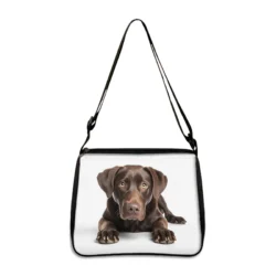 This Bulldog, Beagle, and Pug print shoulder bag features a cute prone dog design on a white background. Ideal for crossbody bag lovers and anyone who loves canine-themed accessories. Perfect as a handbag, phone holder, or gift.