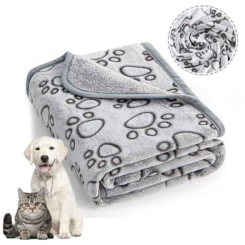 The Soft Fluffy High Quality Pet Blanket is shown folded in gray with black paw prints. In the top right, its rolled up, while a cat and dog sit side by side looking forward in the bottom left.