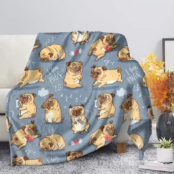 The Flannel Blanket Cute Animal Pug Dog Soft Warm Fall Sofa Fleece Throw features playful cartoon pugs with bones, hearts, and I love pugs text, draped over a gray chair; a vase with orange flowers sits on a nearby table.