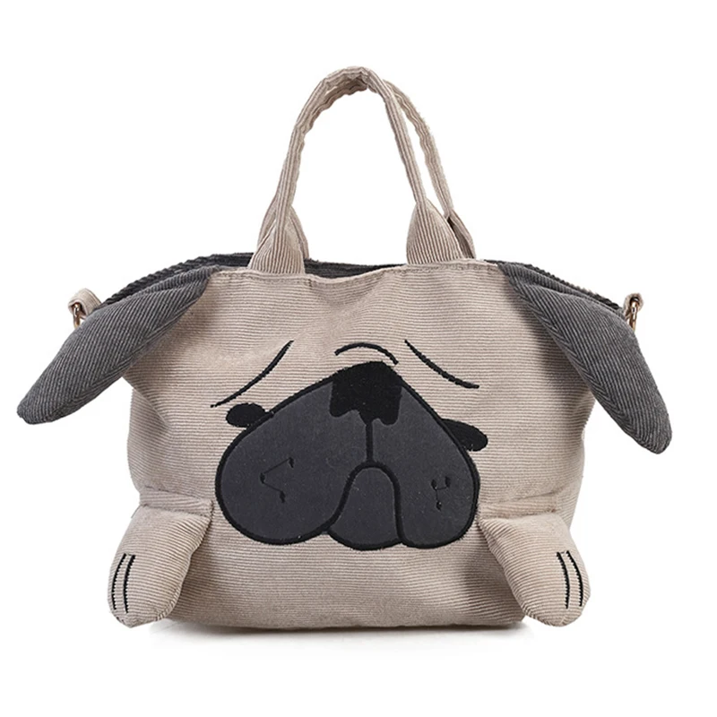 The Large Capacity Corduroy Messenger Bag features a beige design shaped like a dogs face, with floppy gray ears, closed eyes, a black nose, embroidered details, short handles, and paw-shaped corners for a cute and playful look.
