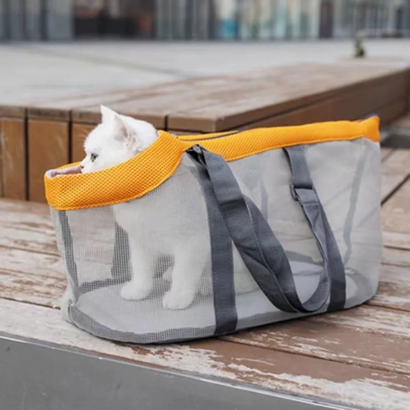 A white cat sits inside the gray Pet Carrier Bags Mesh Foldable Pet Carrier Handbag Purse for Small Dogs on wooden steps. Ideal for miniature schnauzer and cats, its mesh design keeps pets safe, cozy, and lets them look out.