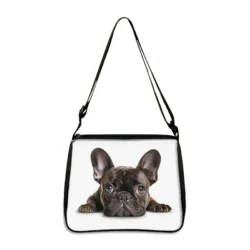 The Cute Prone Dog Shoulder Bag (yxbProneDog04fx) features a lifelike black and brown French Bulldog puppy print on a plain white background””an ideal portable crossbody handbag and phone holder for everyday essentials or as a unique gift.