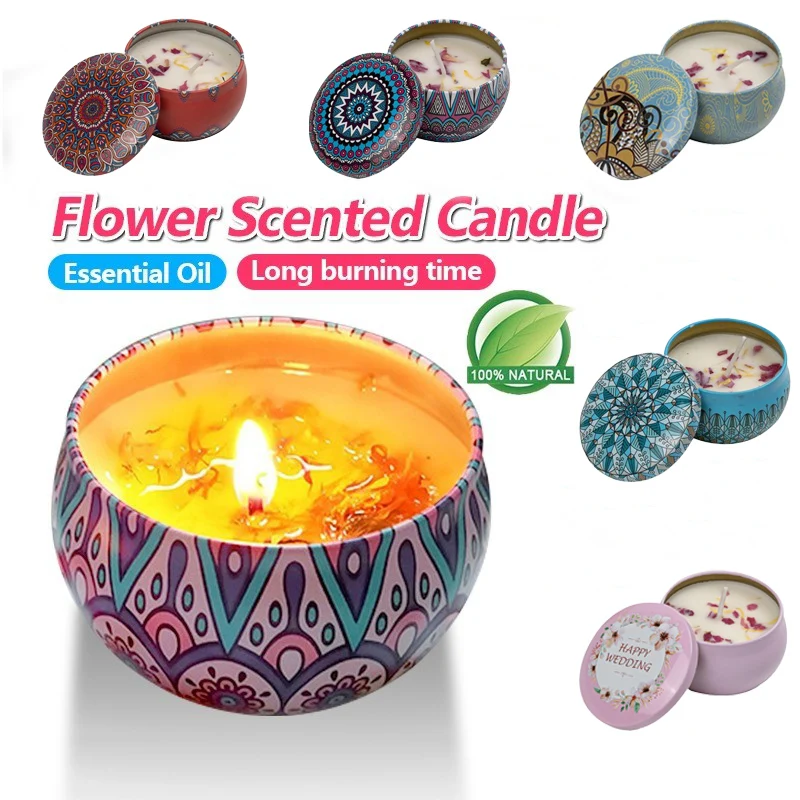 A Handmade Natural Soy Scented Candle with a floral scent glows in a decorative tin featuring colorful geometric patterns, surrounded by six smaller tins, flower petals, and labels highlighting Essential Oil and Long burning time.