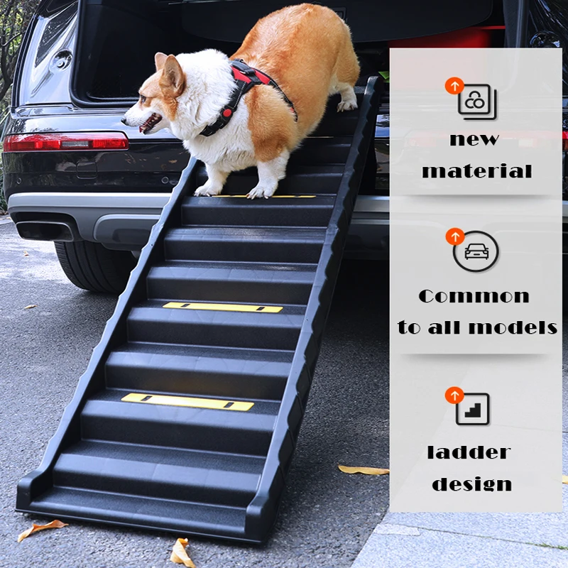 A corgi wearing a harness walks down black Folding Portable Dog Stairs with yellow grips, attached to a car trunk. Text on the right highlights the new material used in all models and the upgraded ladder-style design.