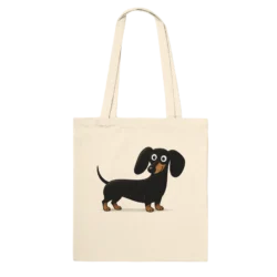 The Classic Tote Bag Natural in cream features a cheerful cartoon black and tan dachshund, has two sturdy handles, and is shown against a plain black background.