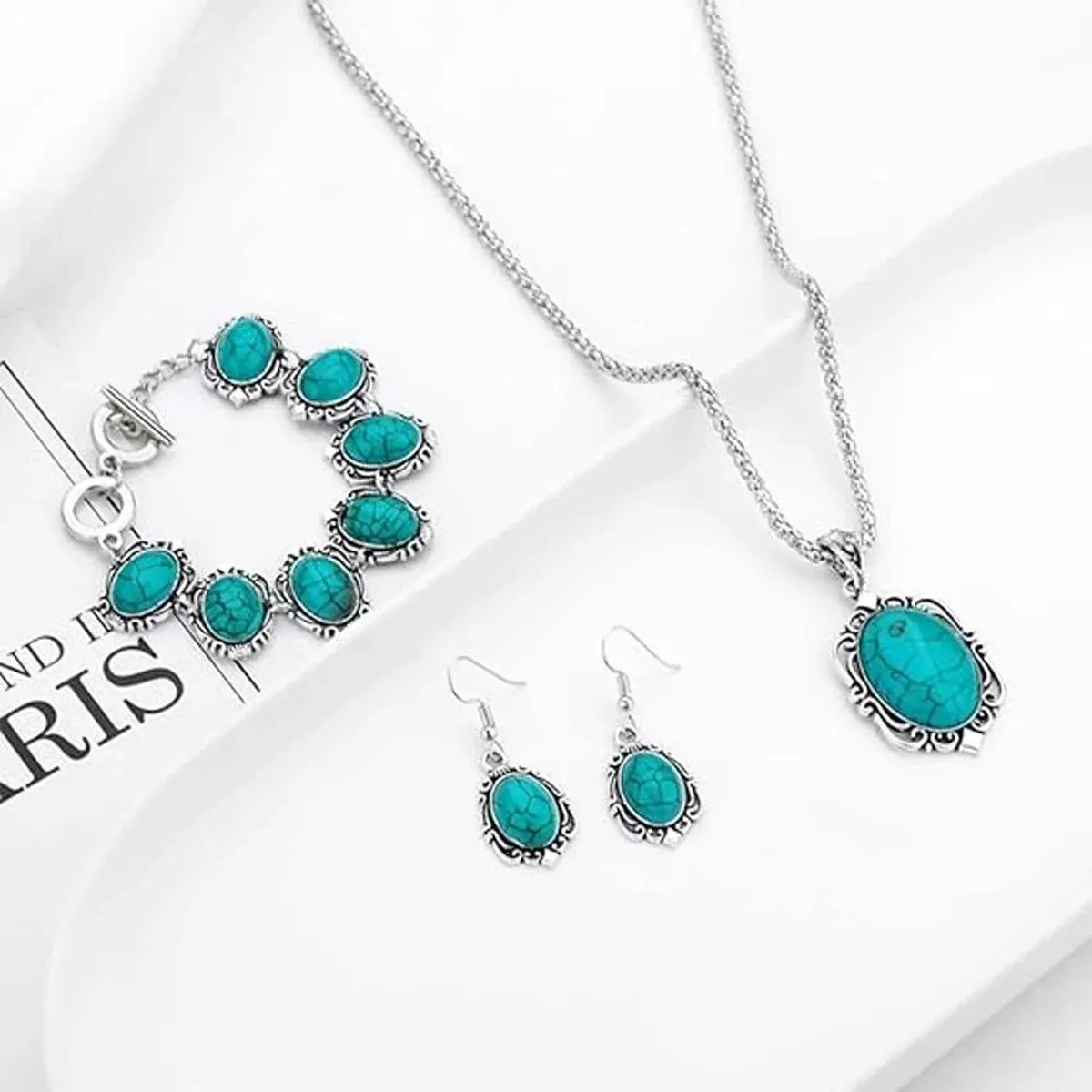 Matching turquoise stone necklace, bracelet, and earrings set for women