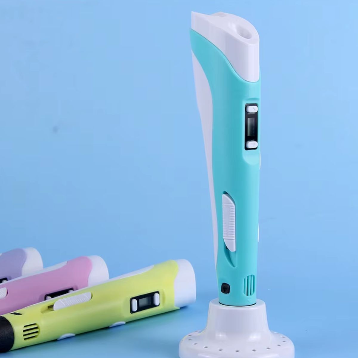 Four colourful 3D printing pens with LED display, suitable for PLA and ABS filaments, arranged on a blue background. Blue 3D pen is in a stand.