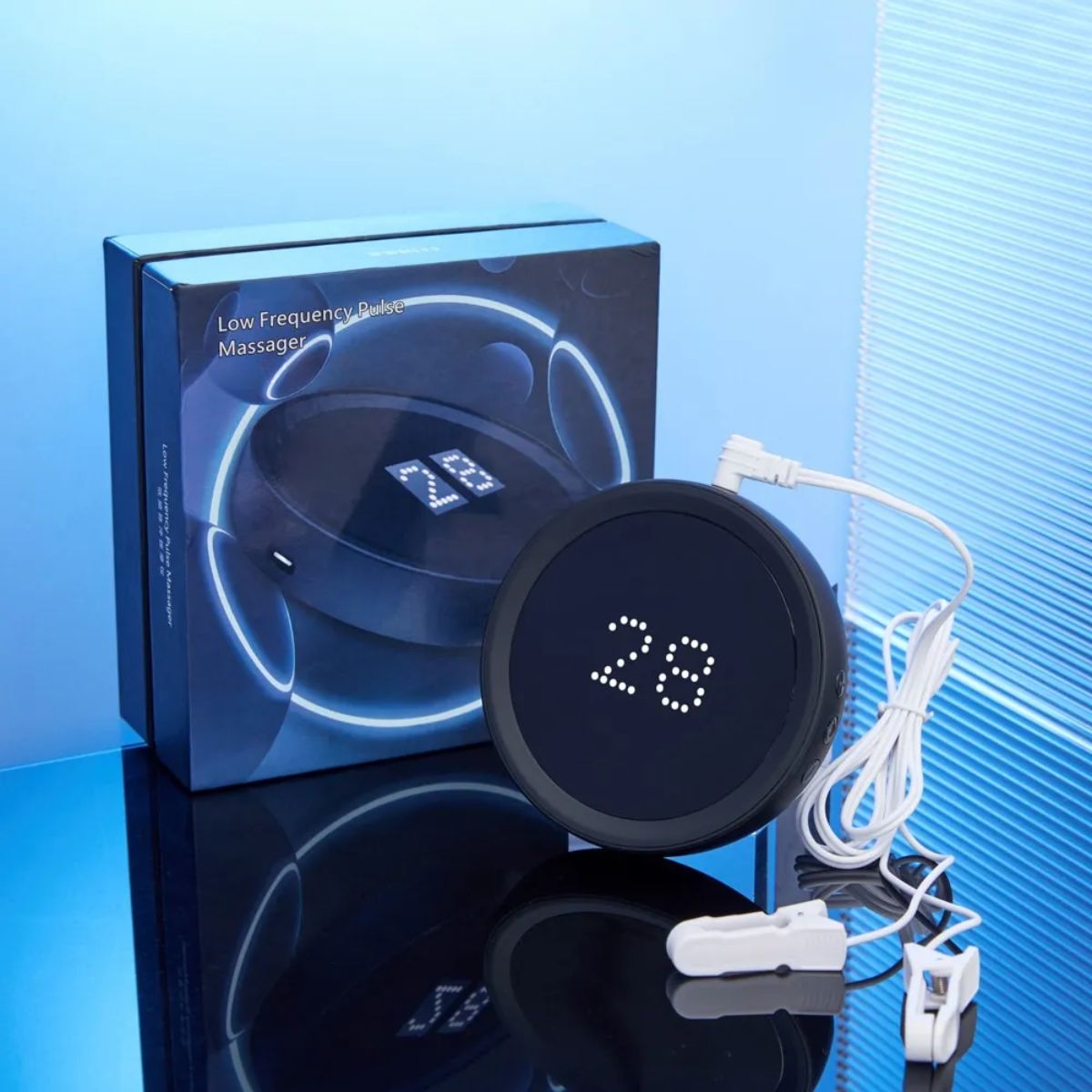 Relaxation sleep aid device displayed with retail box and ear-clip cable accessories.