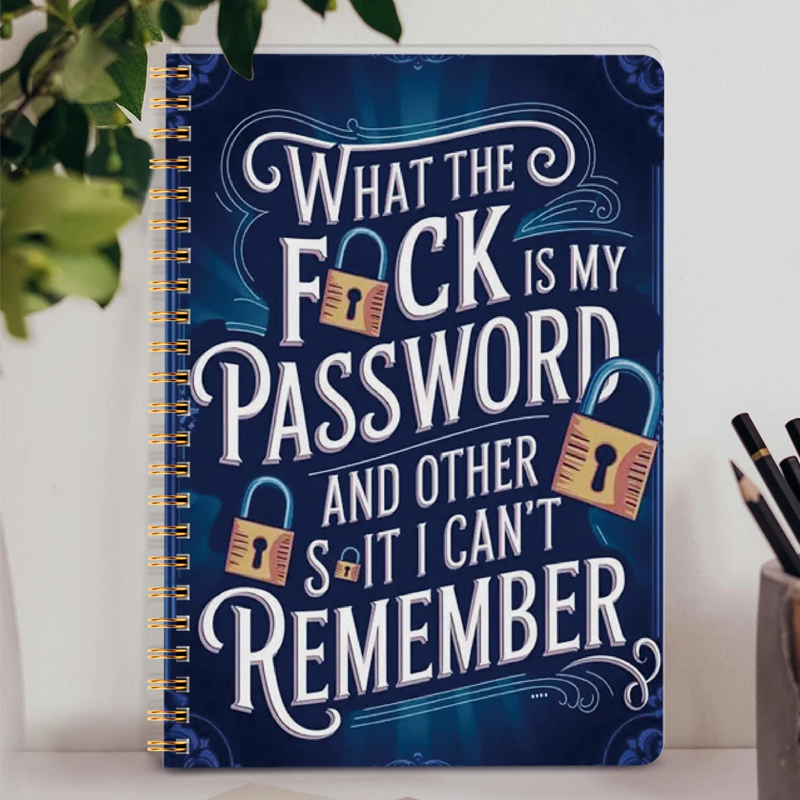 A5 Password Book with spiral binding and structured pages for website logins, notes, and account organisation.