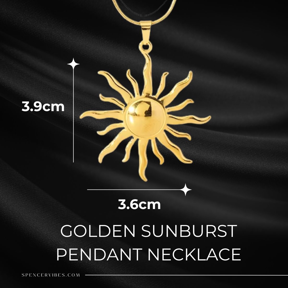 The Golden Sunburst Pendant Necklace, featuring a shiny round center and wavy rays, measures 3.9 cm tall by 3.6 cm wide and is displayed on black satin. Text reads: GOLDEN SUNBURST PENDANT NECKLACE.