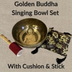 The Golden Buddha Singing Bowl Set with Cushion & Stick features a gold Buddha-etched bowl, red-tipped wooden striker, and black cushion with gold dragon patterns and black tassels.
