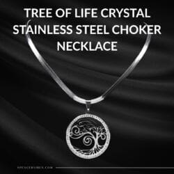 Showcased on sleek black fabric, the Tree of Life Crystal Stainless Steel Choker Necklace features a detailed silver circular pendant with sparkling crystal accents. Bold white text above highlights the product name.